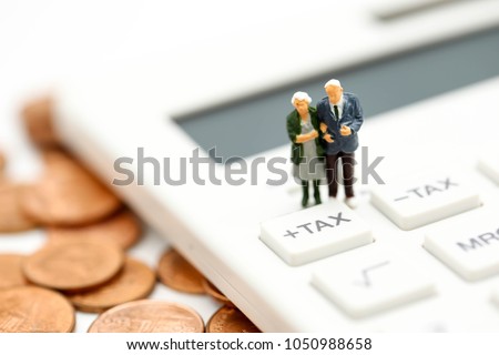 Miniature people : Couple oldman standing with Calculator,business,tax concept.