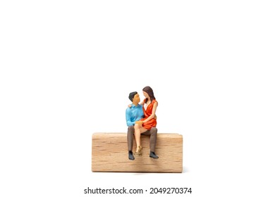 Miniature people Couple sitting on wooden chair and space for text, Valentine's day concept - Powered by Shutterstock