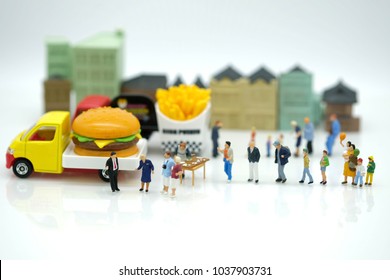 Miniature People : Customer Waiting To Buy Meal From  Mobile Food Truck Use As Franchise , Food Business Concept.