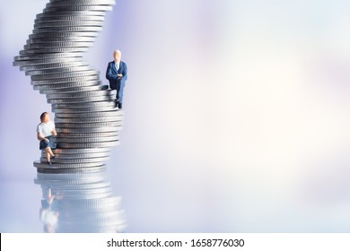 Miniature people: Elderly people sitting on coins stack. social security income and pensions. Money saving and Investment. Time counting down for retirement concept.