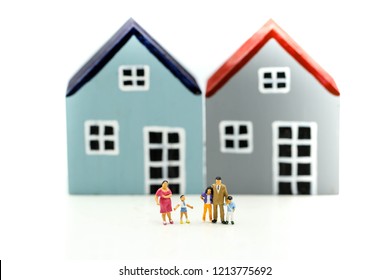 Miniature People : Family With House Using As Business, Family And Property Concept.