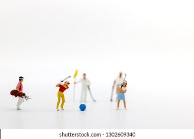 Miniature people: Golfers hit golf balls forward. Target and growth in business concept. - Shutterstock ID 1302609340
