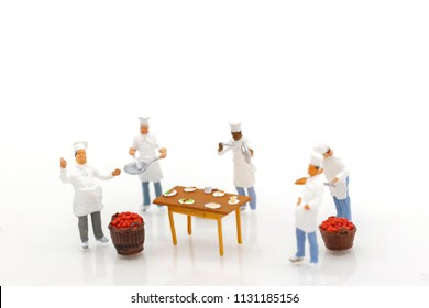 Miniature People: Group Of Chef Is Cooking And Preparation Of Raw Materials For Cooking. Food Concept.