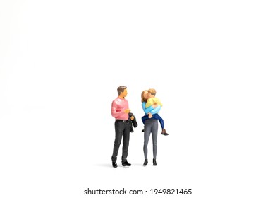 Miniature people Happy family standing on white background and copy space for text - Shutterstock ID 1949821465