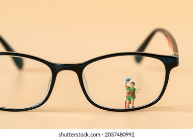 Miniature People Housewife Maid Or Worker Standing And Cleaning Dirty Reading Glasses Using As Hospitality Hotel Cleaning Service Business Or Health Care Healthy And Wellness Life Style Safety Concept