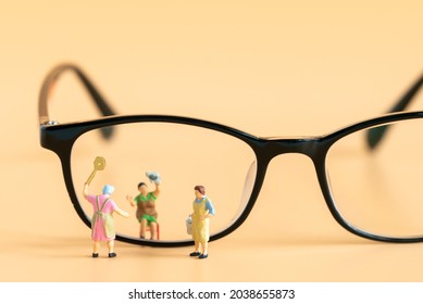 Miniature People Housewife Maid Or Worker Standing And Cleaning Dirty Reading Glasses Using As Hospitality Hotel Cleaning Service Business Or Health Care Healthy And Wellness Life Style Safety Concept