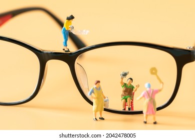 Miniature People Housewife Maid Or Worker Standing And Cleaning Dirty Reading Glasses Using As Hospitality Hotel Cleaning Service Business Or Health Care Healthy And Wellness Life Style Safety Concept