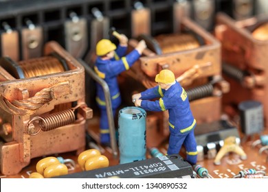 Miniature People Maintenance Electronic Device Component.