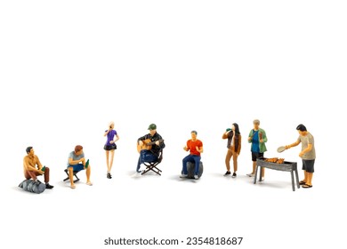 Miniature people are making barbeque, drinking beverages, making memories, and laughing isolated on white background
