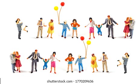 Miniature People On White Background.