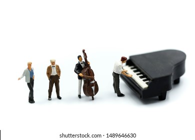 Miniature people : pianist playing piano and Violinist Man,playing musical instrument concept. - Powered by Shutterstock