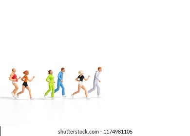 Miniature people running on white background , Healthy lifestyle and sport concepts. - Shutterstock ID 1174981105