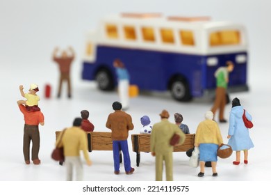 Miniature People Saying Goodbye At The Bus Stop.