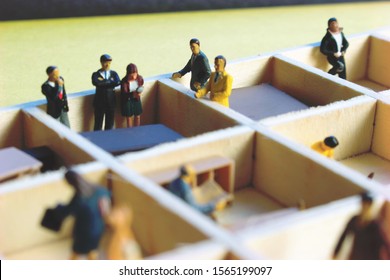 Miniature People Separated In Office Cubicles.Work In A Sterile Office Environment. People Divided In Little Boxes. Personal Space To Complete Your Work. Office Politics, Romance, Or Drama.