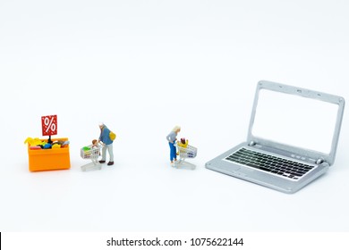 Miniature People : Shoppers For Online And Offline Businesses. Image Use For Retail Business, Marketing Place Concept.