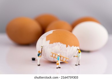 Miniature people small model human figure painting brown Eggs to white - Shutterstock ID 2164759303