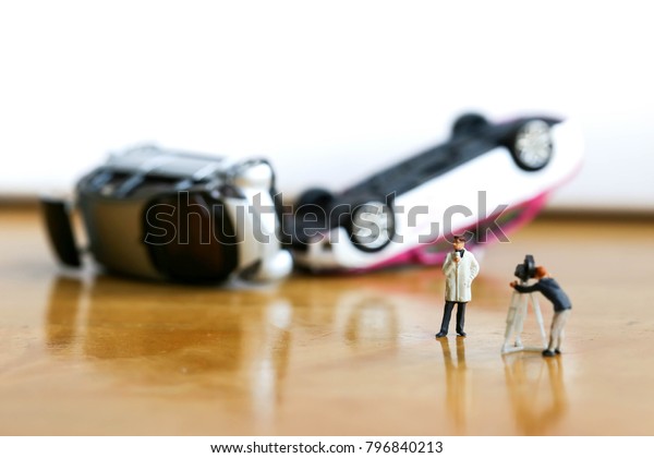 Miniature people : the small team of tv reporter\
of car accident