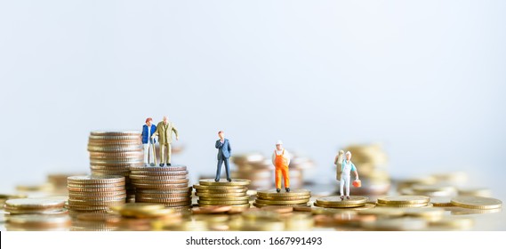 Miniature People Standing On Stack Of Coins. Inequality And Social Class. Income And Economic Inequality Concept. Inequality In Social Class, Ideology, Gender, Racial And Ethnic And Health.