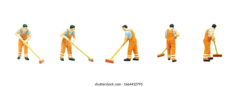 Miniature People As Street Cleaning Worker Posing In Posture Isolated On White Background.