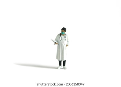 Miniature people toy figure photography. A women doctor wearing coat standing with handing medical checkup document, isolated on white background. Image photo - Powered by Shutterstock