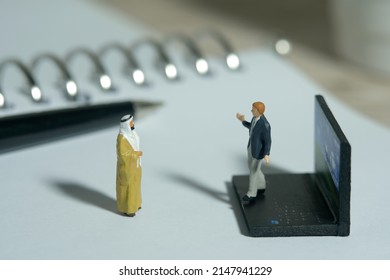 Miniature People Toy Figure Photography. Business Presentation Meeting. A Businessman Doing Presentation In Front Of King Sultan At Office. Image Photo