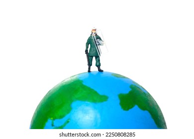 Miniature people toy figure photography. A military anti riot armored army standing above earth globe. Isolated on white background. Image photo