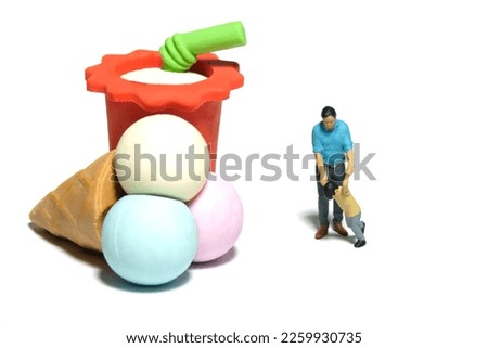 Miniature people toy figure photography. Kids begging for ice cream and juice concept. A father and son walking toward ice cream and juice. Isolated white background. Image photo