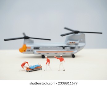 Miniature people and unfocus plane at table. Background is blurred.