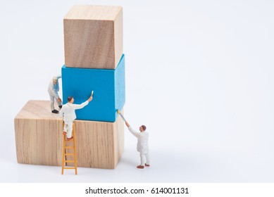 miniature people worker painting wood cube building block