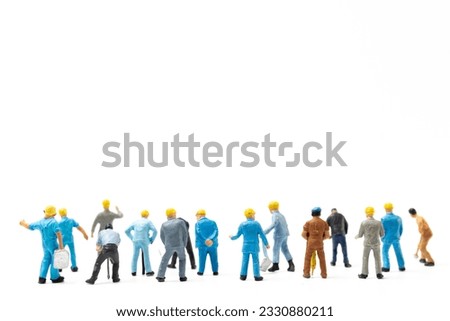 Miniature people , Worker team standing on white background and copy space for your text , Labour day concept