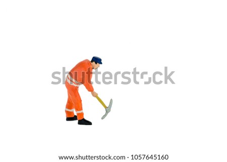 Miniature people worker wearing safety construction concept on white background with a space for text