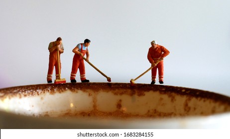 Miniature People: Workers cleaning coffee cups, Removing coffee stains. Concept: cleanliness and safe to drinking in coffee shop. - Powered by Shutterstock