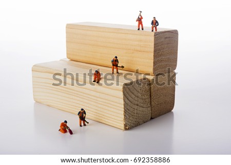 Miniature people workers occupation isolate on white background. Industrial and construction concept