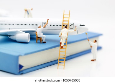 Miniature People: Workers  Team Brush Painting Airplane. Concept Maintenance Of Aircraft
