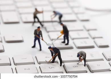 Miniature people working with PC - Powered by Shutterstock