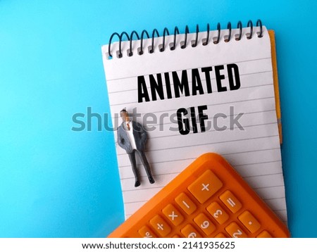 Miniature people,calculator and notebook with text ANIMATED GIF on a blue background.