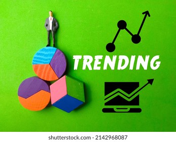 Miniature People,colored Block And Icon With Text TRENDING On Green Background.