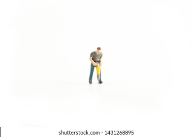 Miniature Person Using A Jack Hammer