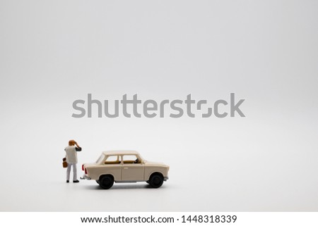 Miniature Photographer take a photo shot with white background, use for advertisement material to show concept of stop the car and take a product photo shot, promotion , compatible with other business