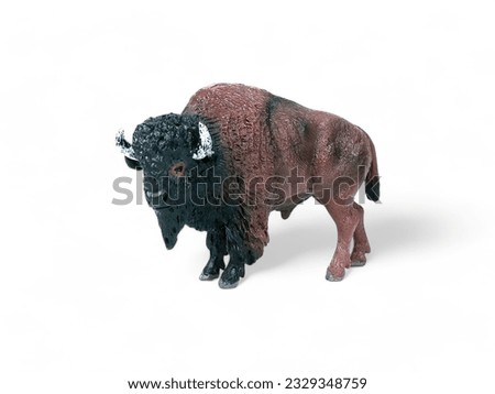 Miniature plastic bison animal isolated on white