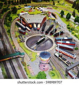 Miniature Railway Train Station Model With Many Trains.