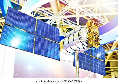 Miniature satellite cubesat with solar panels on space exhibition - Powered by Shutterstock