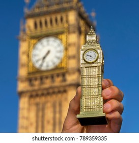 Miniature Souvenir Big Ben Hold In Front Of Real Big Ben. London, UK 