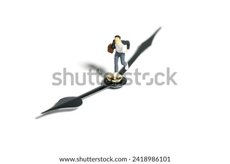 Miniature tiny people toy photography. A boy student wearing school uniform running above clockwise. Isolated on white background. Image photo
