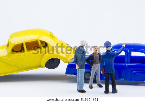Miniature tiny toys car crash accident\
damaged.Accident on the road\
background