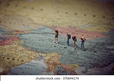 Miniature tourists in China. Color tone tuned. Macro photo - Powered by Shutterstock