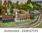 Miniature Town with Model Train and Autumn Trees