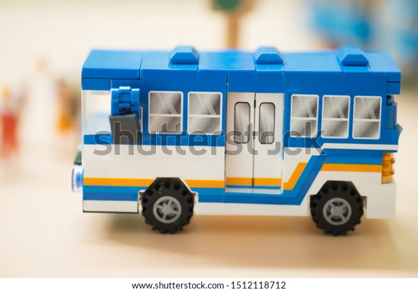 Miniature\
toy bus. People travel by bus in Bangkok. Buses are one of the most\
important public transport system in\
Bangkok.