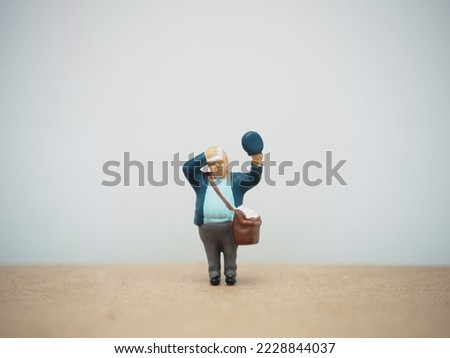 Miniature toy at table with blurred background.