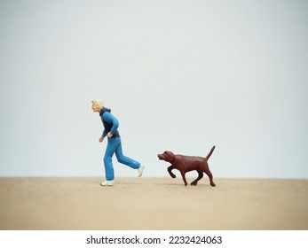 Miniature toy at table with white background. - Powered by Shutterstock